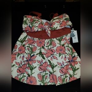 NWT one piece floral swimsuit with tummy cut out